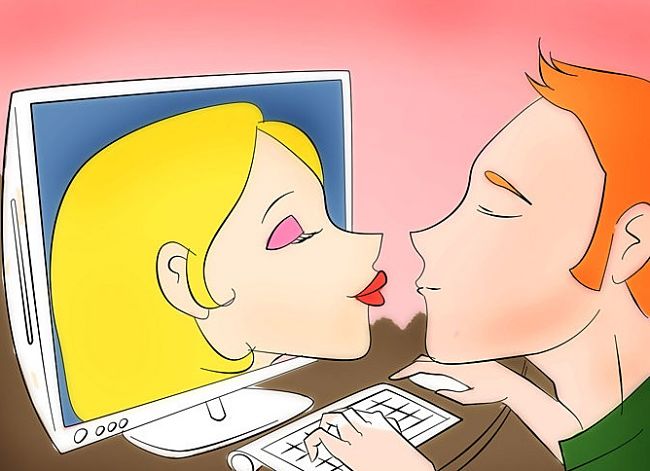 парень целует девушку через монитор компьютера